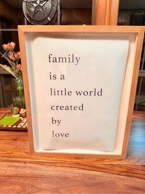 ‘family is a little world created by love’ 16” by 20” by 1” framed Target print.